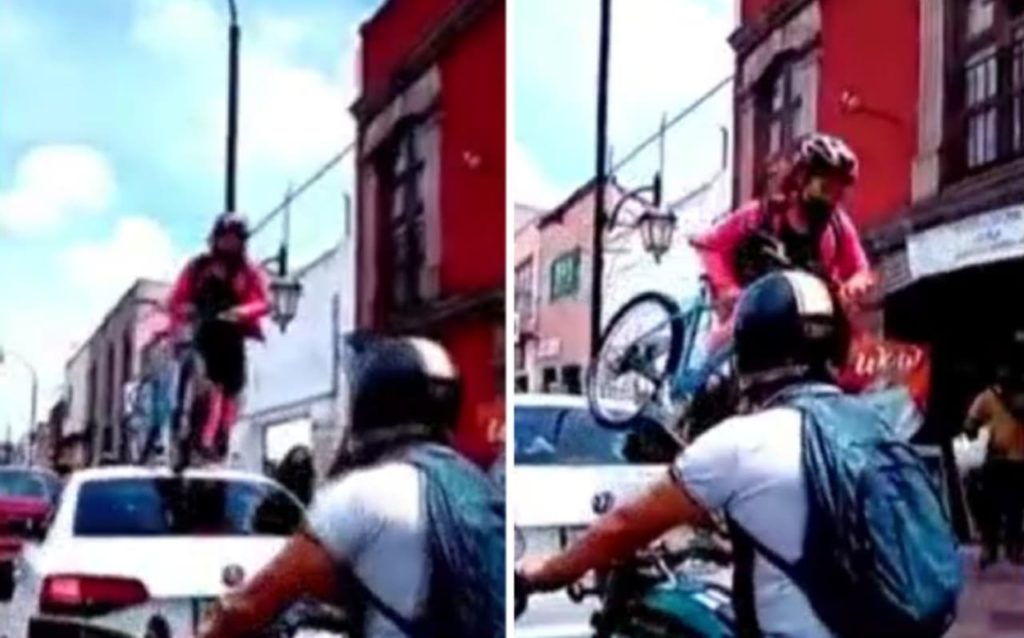 Ciclista pasa su bici por encima de auto que no respetó la ciclovía